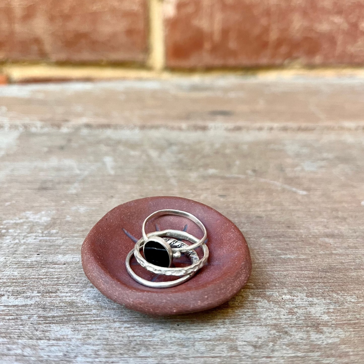 carved star ring dish | red earth